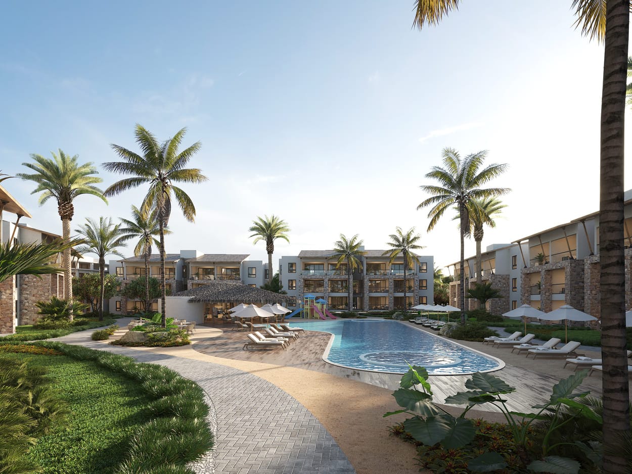 Fachada y áreas comunes del proyecto TH Oasis en Playa Nueva Romana